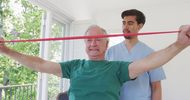 Senior Man Engaged in Resistance Stretching with Physiotherapist - Download Free Stock Images Pikwizard.com