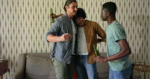 Group of Friends Celebrating and Enjoying Drinks at Home