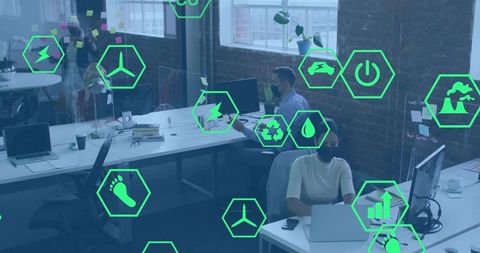 Working in Loft Office with Green Energy Icons Overlay Representing Sustainability
