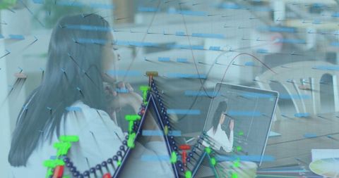 Businesswoman Engaging in Virtual Meeting with Overlay of Financial Data