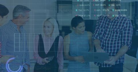 Business team analyzing digital data within modern workspace