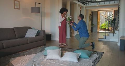 man proposing to woman at home with joyful reactions - Download Free Stock Images Pikwizard.com
