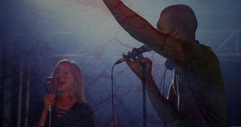 Singers Performing on Stage Under Electric Lighting