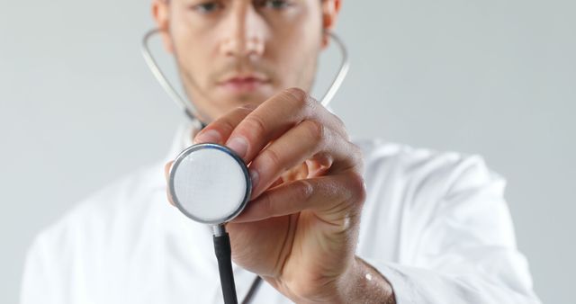 Doctor Holding Stethoscope in Medical Examination - Download Free Stock Images Pikwizard.com