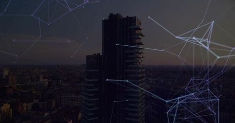 High-rise at dusk with glowing network overlay in urban cityscape