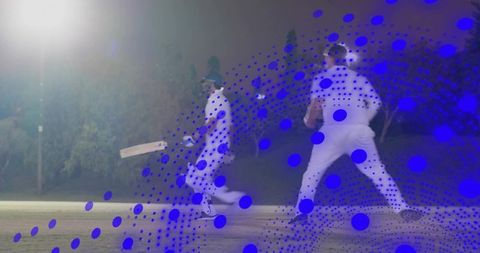 Night cricket action batsman running to crease under floodlights with fielder closing in
