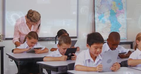 Tech-Savvy Students with Teacher Exploring Tablets