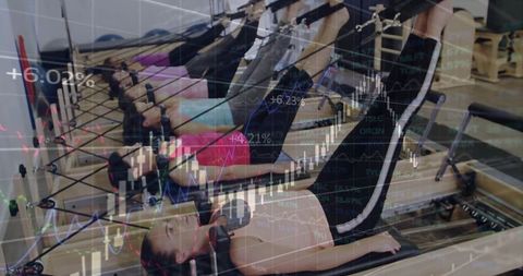 Women Practicing Pilates on Reformers with Superimposed Stock Chart
