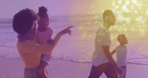 Family Enjoying Peaceful Beach Walk at Sunset with Golden Glow