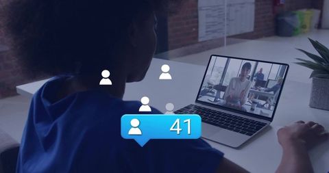 Woman Joining Virtual Meeting on Laptop with Engagement Bubble Showing 41