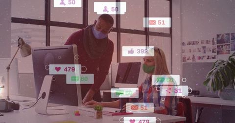 Collaborating over social media engagement metrics on desktop in modern masked office