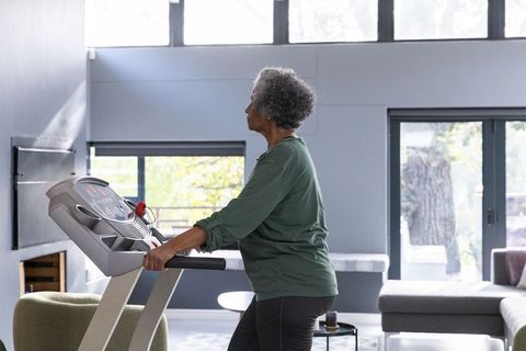 Senior Woman Exercising at Home Demonstrating Healthy Lifestyle and Fitness