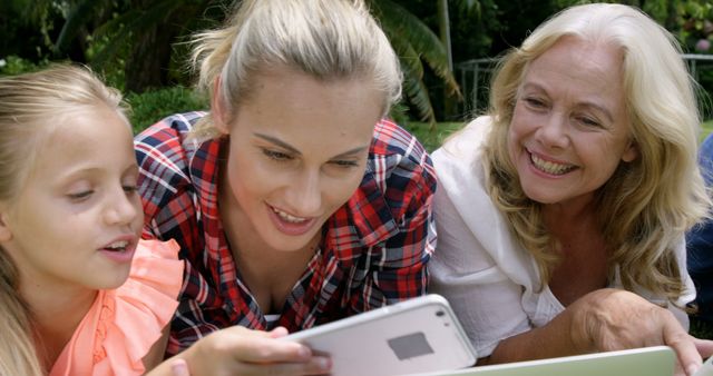 Happy Three Generations of Women Using Tablet Outdoors - Download Free Stock Images Pikwizard.com