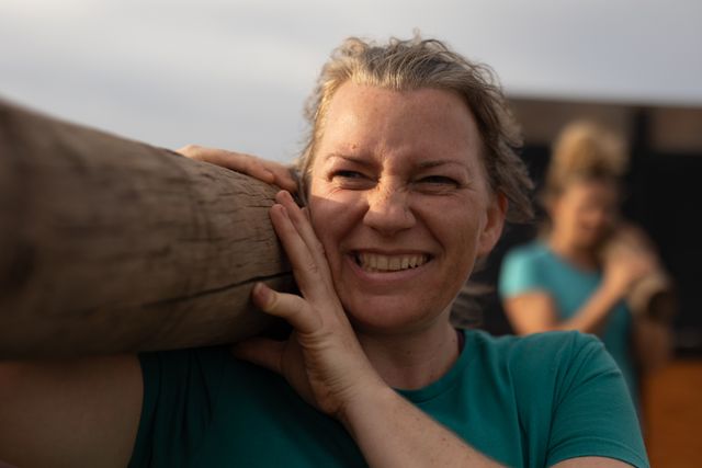 Caucasian Woman Carrying Log During Outdoor Boot Camp Training - Download Free Stock Images Pikwizard.com