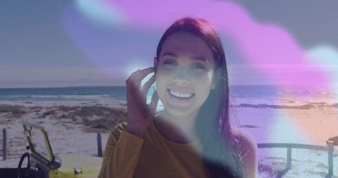 Happy Woman Exploring Scenic Seaside with Vibrant Overlay