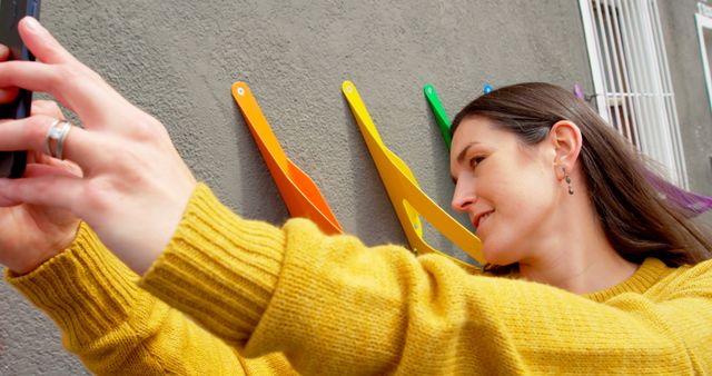 Young Woman Taking Selfie with Colorful Wall - Download Free Stock Images Pikwizard.com