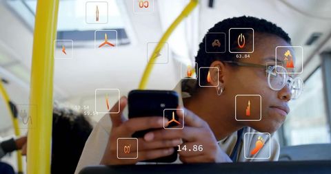 Commuter holding smartphone using augmented reality transit interface on city bus
