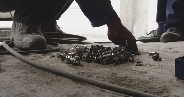 Close-up of Mechanic Sorting Tools on Garage Floor - Download Free Stock Images Pikwizard.com