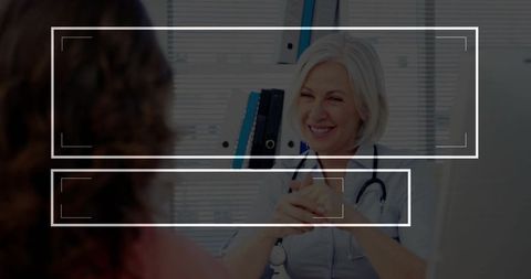 Smiling Physician Consulting Patient in Modern Medical Office