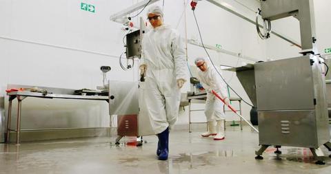 Butchers in Sanitary Uniforms Cleaning Meat Processing Area - Download Free Stock Images Pikwizard.com