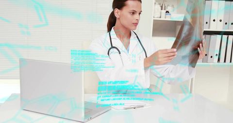 Female Doctor Analyzing X-Ray with Digital Data Display - Download Free Stock Images Pikwizard.com