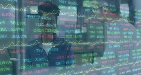 Diverse Business Professionals Analyzing Stock Market Graphs