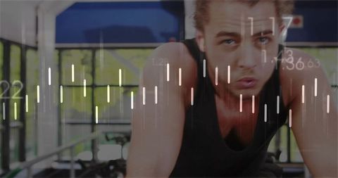 Pedaling man training on stationary bike with digital fitness data overlays and performance