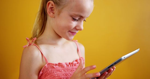 Young Girl Using Tablet Learning in Bright Classroom - Download Free Stock Images Pikwizard.com