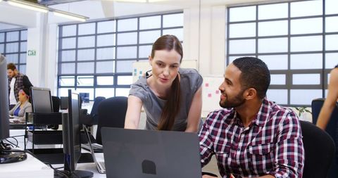 Diverse Teams Collaborating in a Modern Open Office