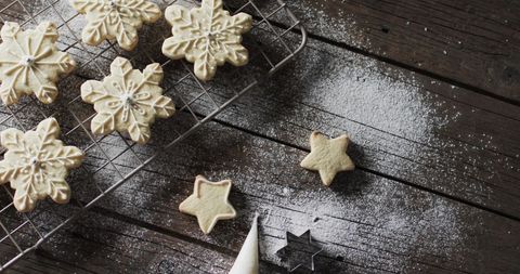 Homemade Holiday Star Cookies with Powdered Sugar on Rustic Table - Download Free Stock Images Pikwizard.com