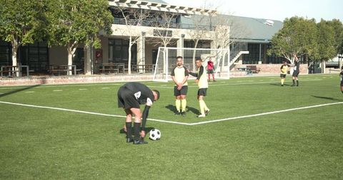 Soccer Players Preparing Free Kick During Outdoor Match