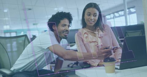 Colleagues Analyzing Financial Data on Computer in Modern Office