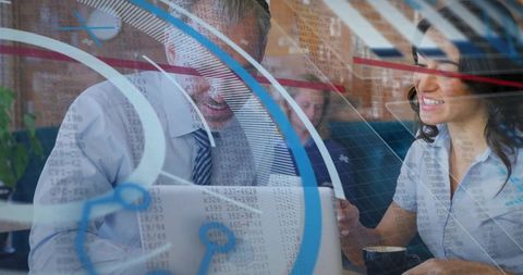 Business professionals collaborating over laptop with digital data overlay and glass reflections