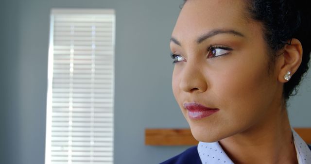 Confident Woman in Office Looking Through Window - Download Free Stock Images Pikwizard.com