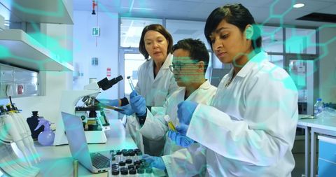 Diverse Scientists Collaborating with Advanced Medical Data in Laboratory - Download Free Stock Images Pikwizard.com