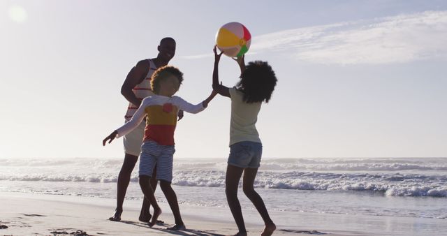Happy family enjoys a playful day on a sunny beach, bonding over a game with a colorful beach ball. Perfect for ads highlighting family vacations, summer activities, travel destinations, and outdoor fun, showcasing joy and connection by the ocean.