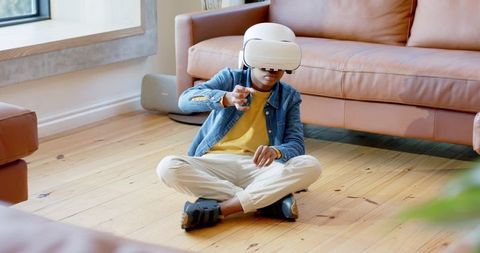 African American Boy Exploring Virtual Reality at Home Wearing VR Headset