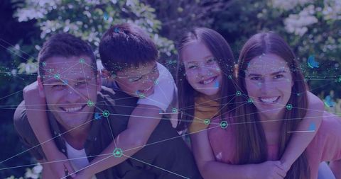 Happy Family Embracing in Sunlit Garden with Digital Network Overlay for Tech and Wellness