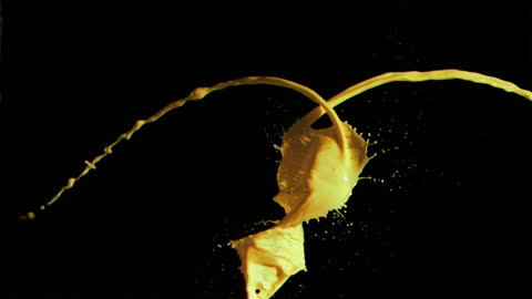 Dynamic Yellow Paint Splash in Slow Motion