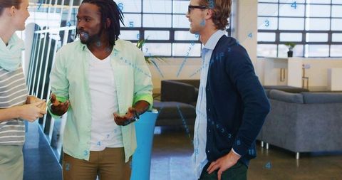 Young professionals collaborating in modern office lounge for casual brainstorming session