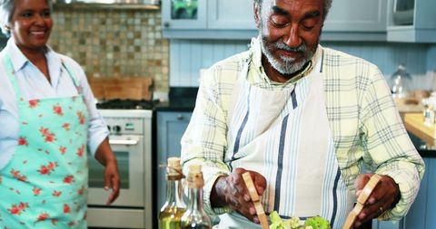 Senior Couple Enjoys Preparing Vegetarian Meal Together
