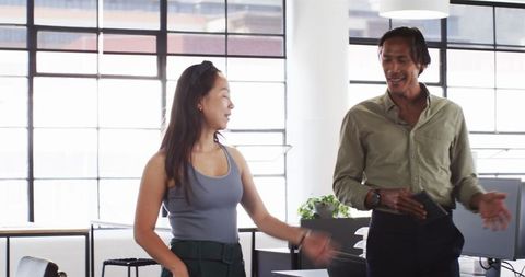 Asian Professionals Collaborating in Modern Office Environment