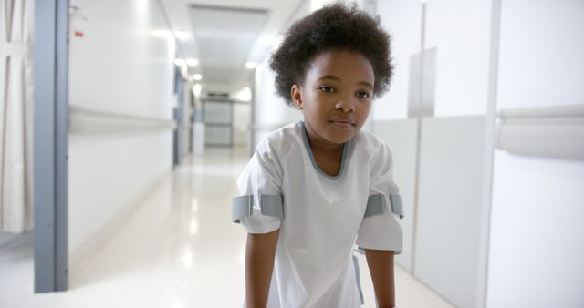 Child in Hospital Hall Using Crutches - Download Free Stock Images Pikwizard.com