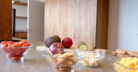 Fresh Vegetables and Ingredients on Kitchen Counter for Meal Preparation