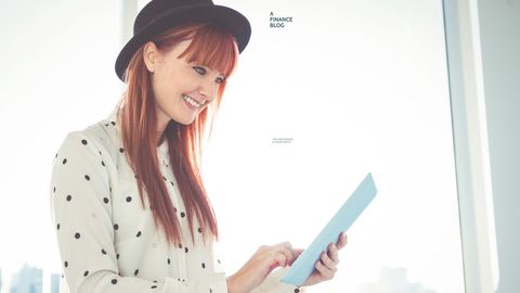 trendy woman with tablet in bright room engaged in finance blog - Download Free Stock Templates Pikwizard.com