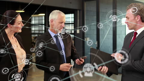 Business Team Discussing Digital Network Solutions in Modern Office