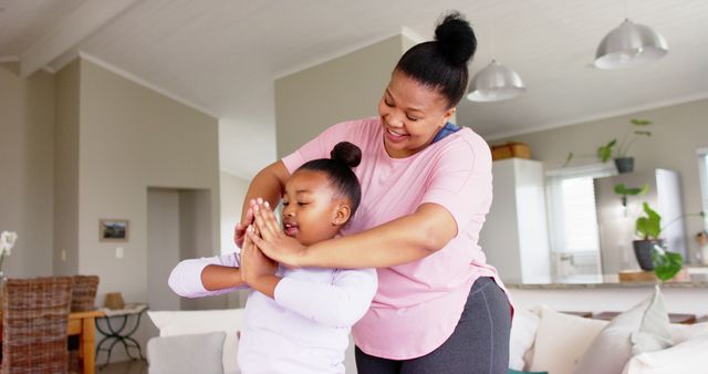 Mother and Daughter Doing Yoga Exercise at Home - Download Free Stock Images Pikwizard.com