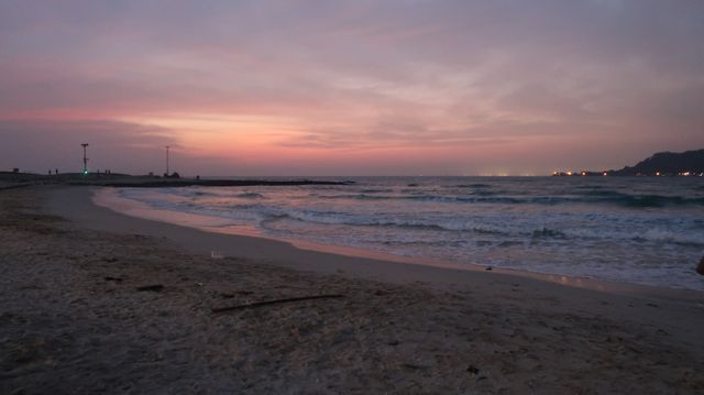 Serene Sunset Beach with Gentle Waves and Pastel Sky - Download Free Stock Photos Pikwizard.com