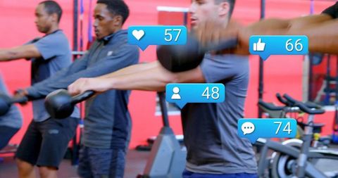 Group kettlebell swing workout in gym with social media engagement icons and metrics