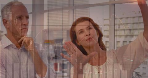 Business colleagues analyzing financial data trends